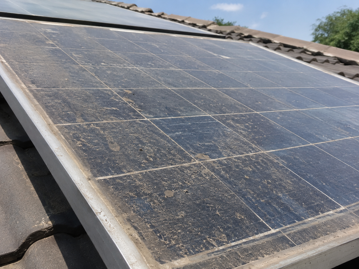 Dirty solar panel covered in dust and environmental buildup